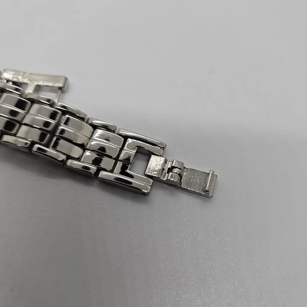silver tone watch with rhinestone digits